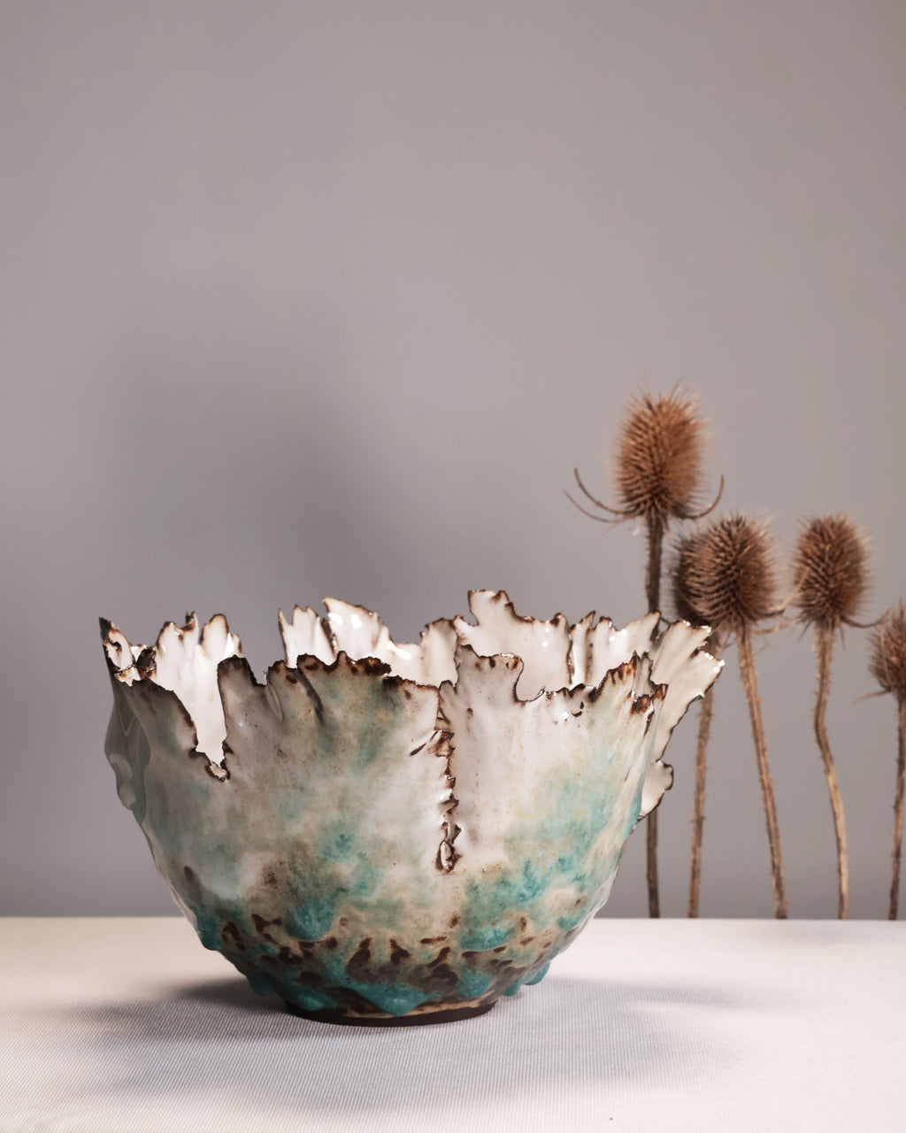 Ceramic bowl with textured surface on a neutral background