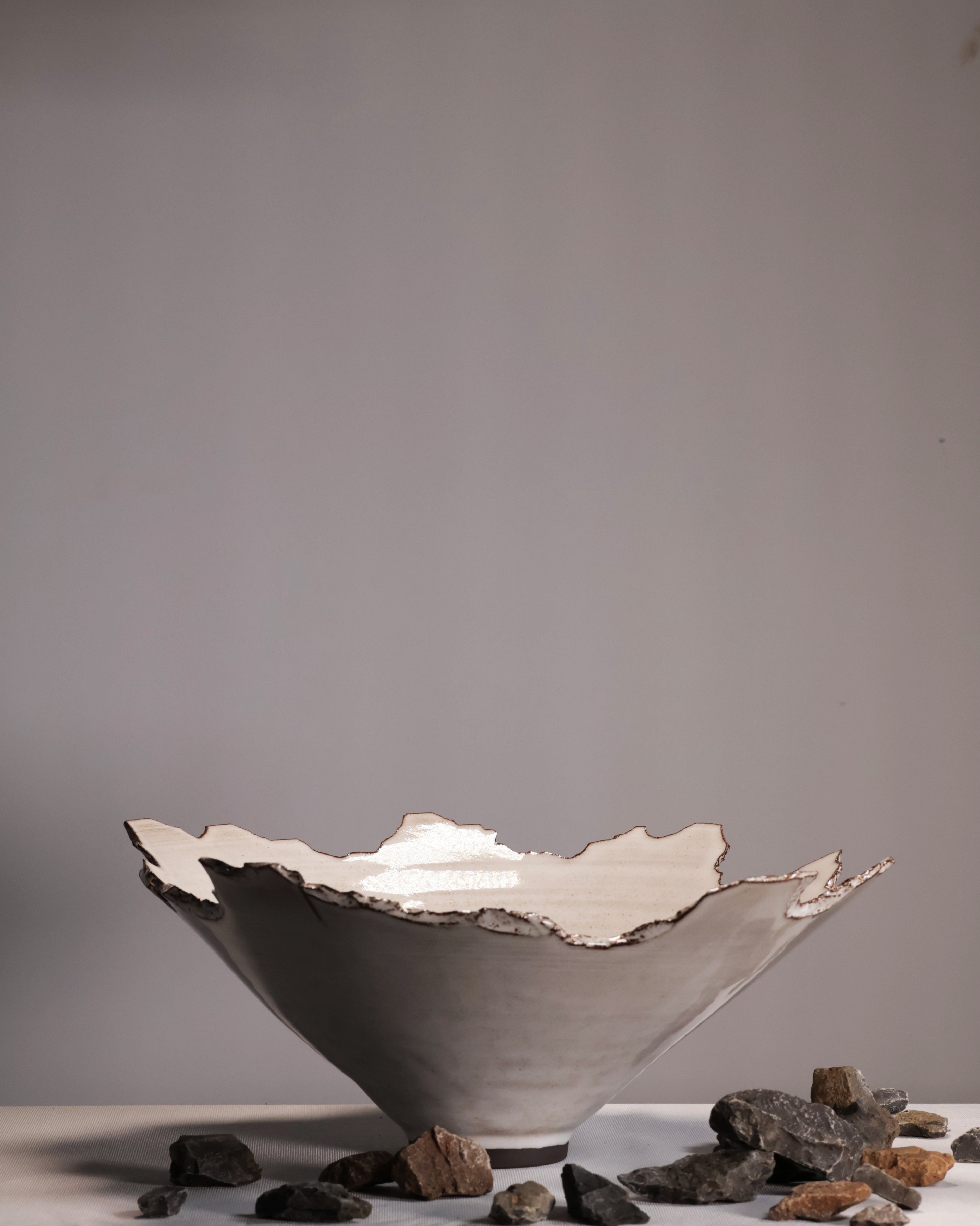 Ceramic bowl with a textured surface on a gray background