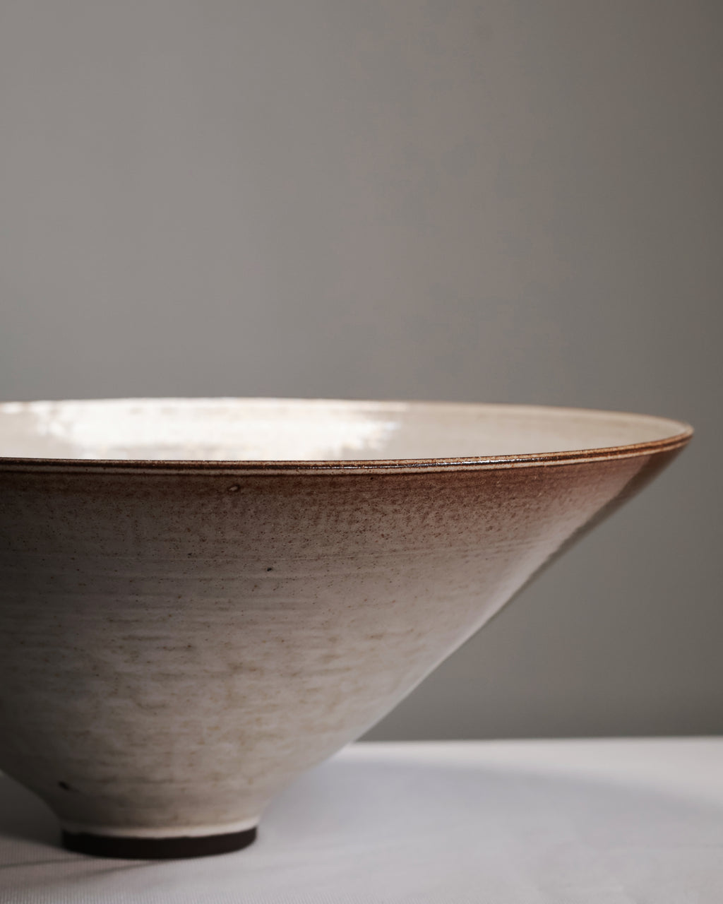 Ceramic bowl with a textured surface on a gray background