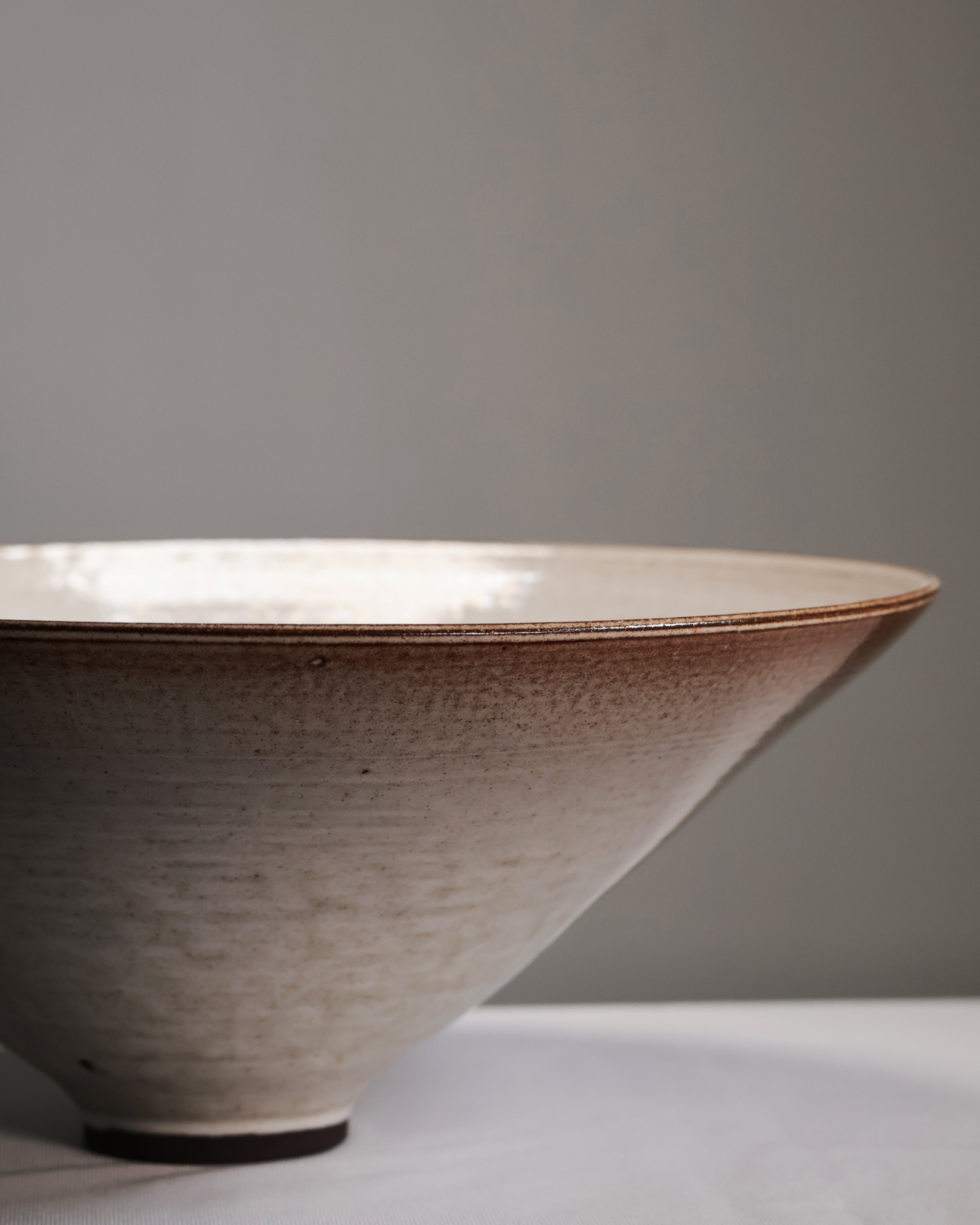 Ceramic bowl with a textured surface on a gray background