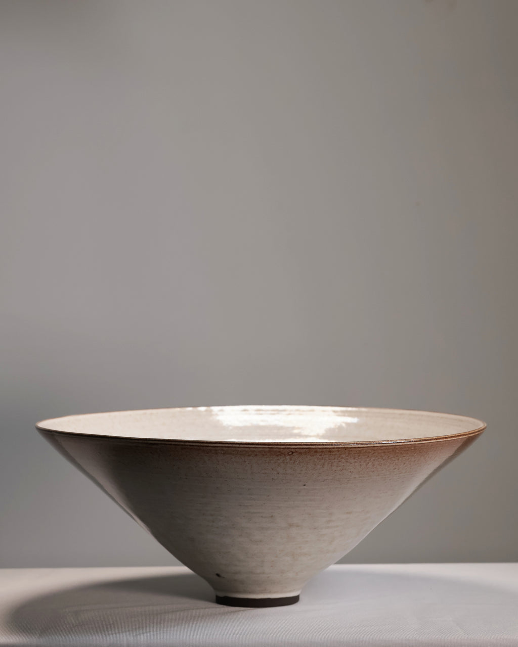 Ceramic bowl with a textured surface on a gray background