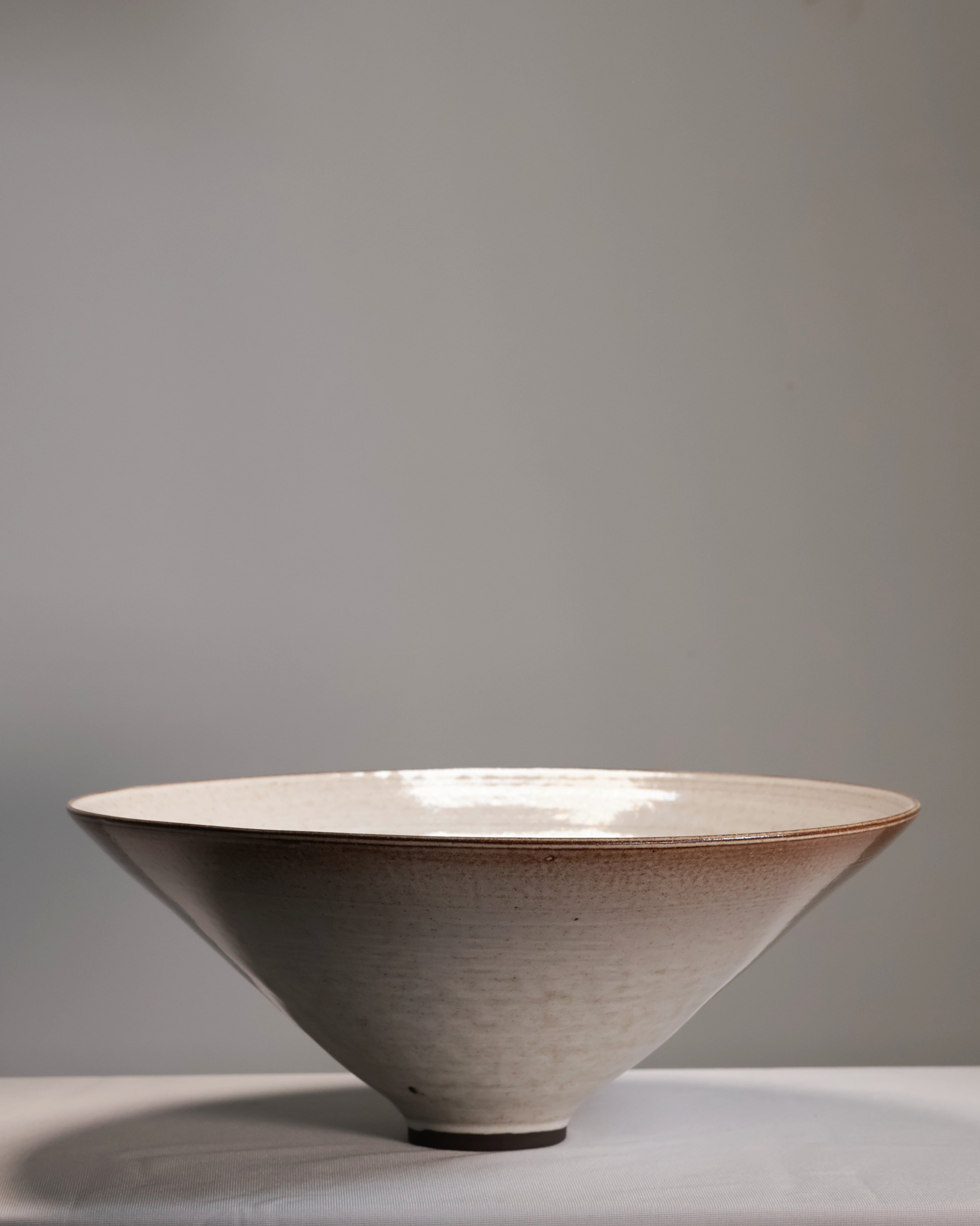 Ceramic bowl with a textured surface on a gray background